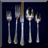 K03. Oneida “Golden Juilliard” stainless flatware including 10 place settings and serving pieces 